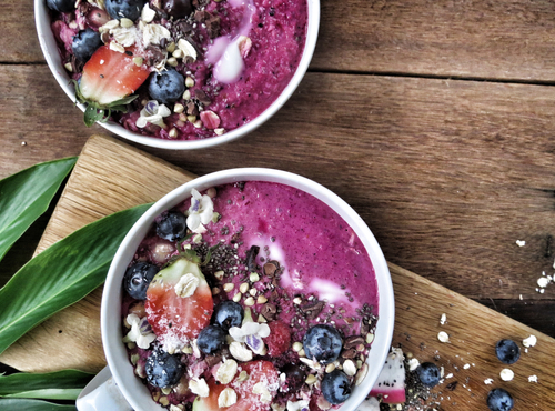 Acai,Pink,Smoothie,Bowls,On,Cutting,Board.